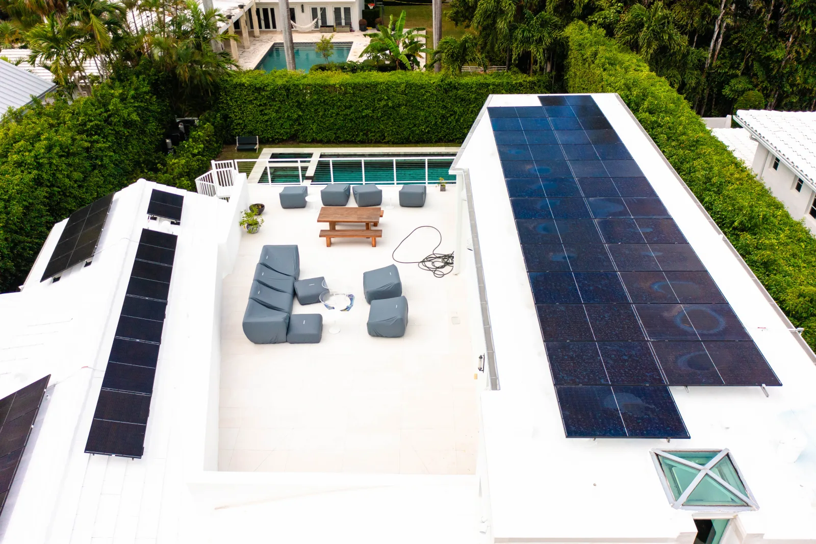 Aerial view of solar arrays and the finished white roof deck at 2820 Lucerne Avenue.